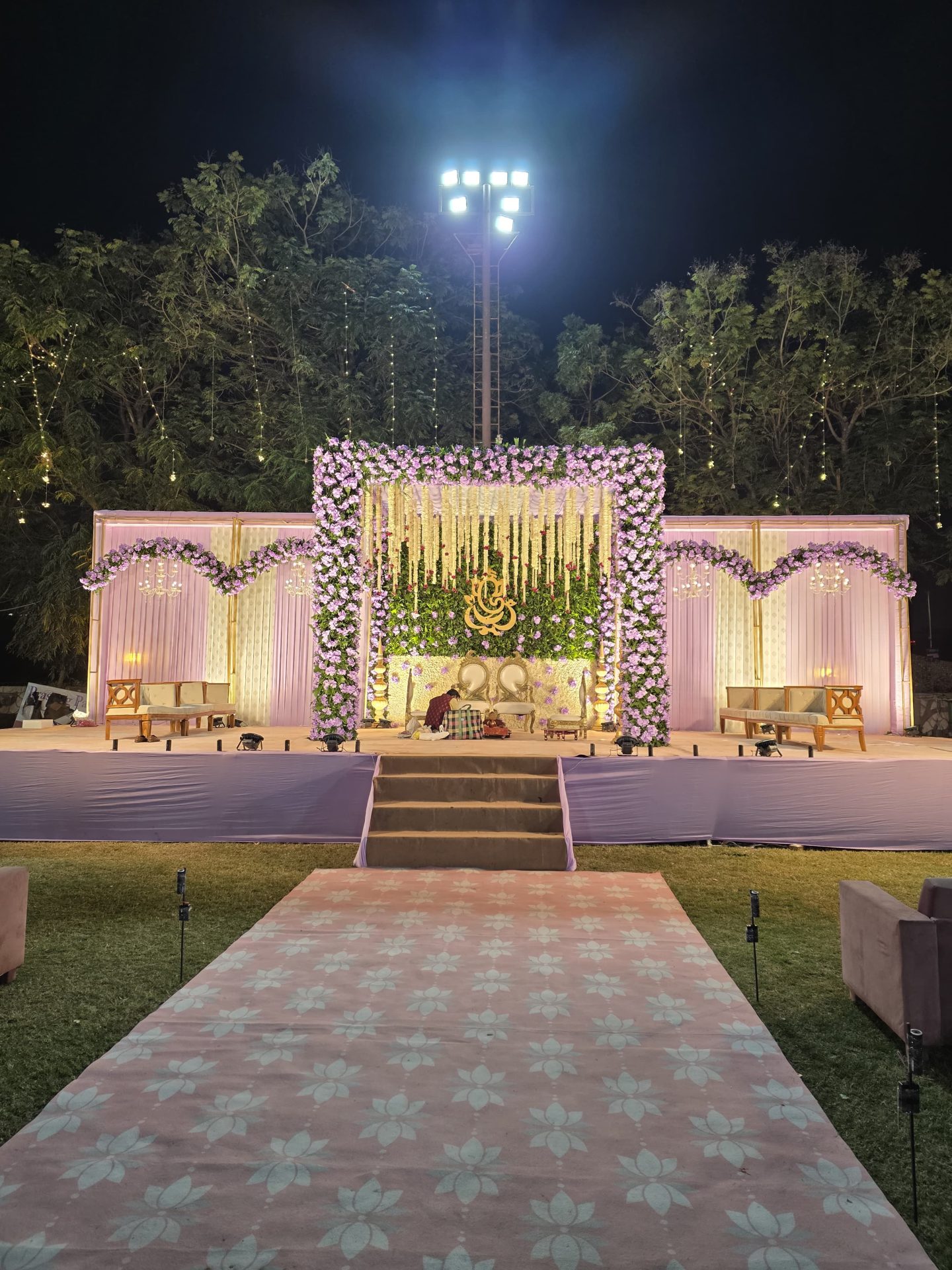 Lilac floral arch stage decoration for a wedding reception in Ahmedabad